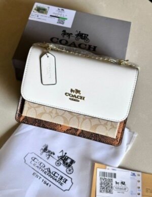 COACH KLARE CROSSBODY IN BLOCKED SIGNATURE CANVAS (WHITE)